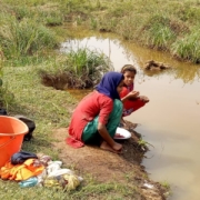 Young Rohingya women washing clothes